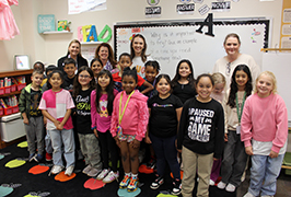  A group of students and adults stand together